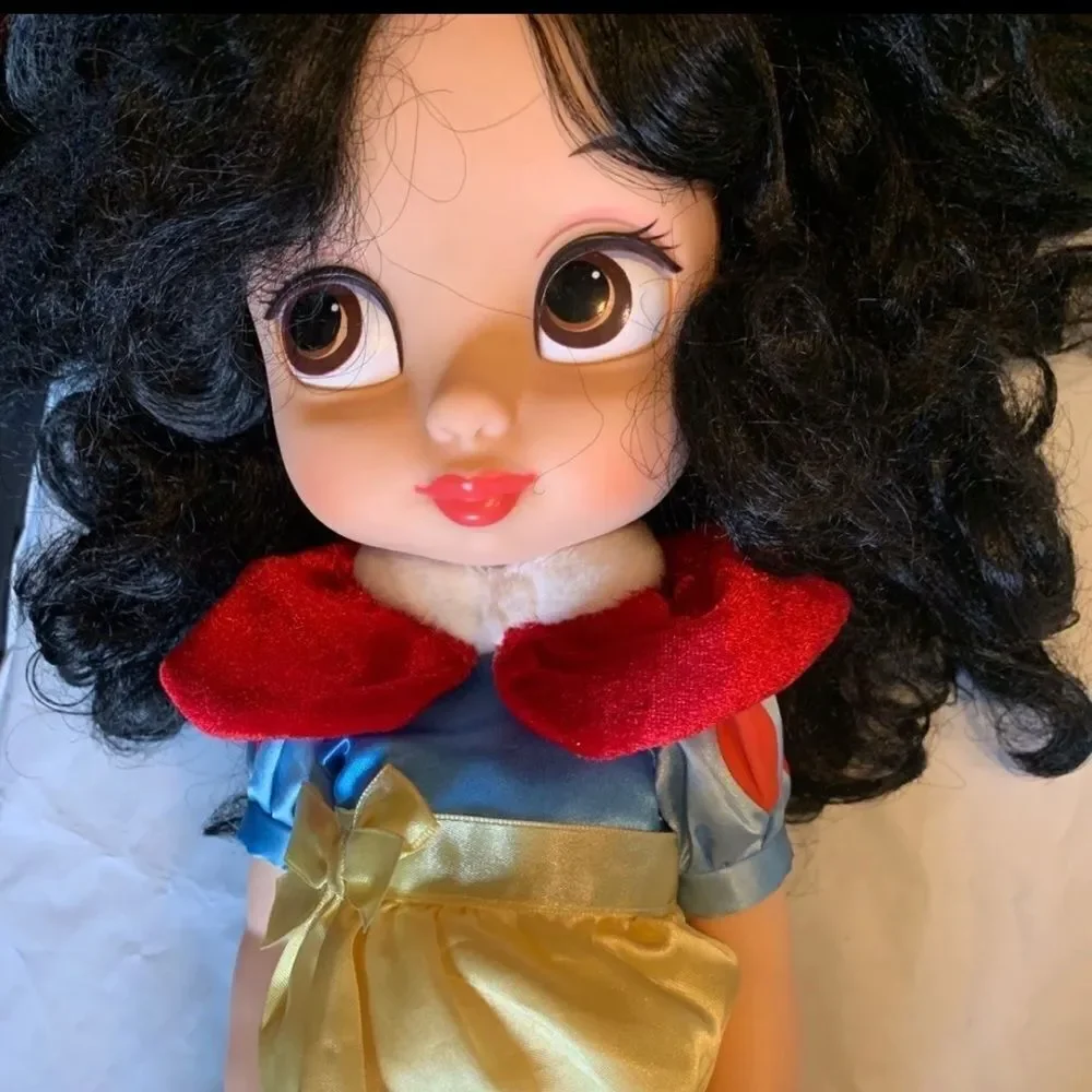 Please see Pictures! No shoes and ink marks on one leg. Exclusive doll!